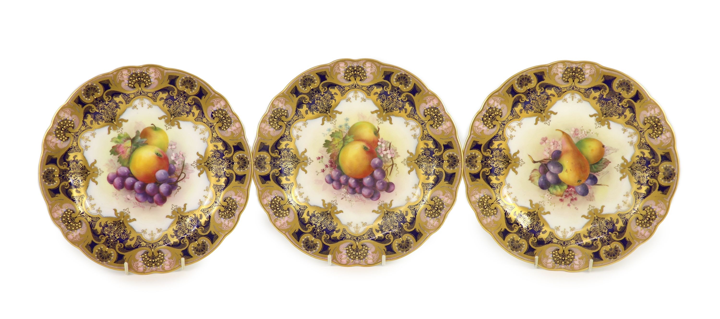 Three Royal Worcester fruit painted dessert plates, signed E. Phillips, c.1918, 22.5cm diameter